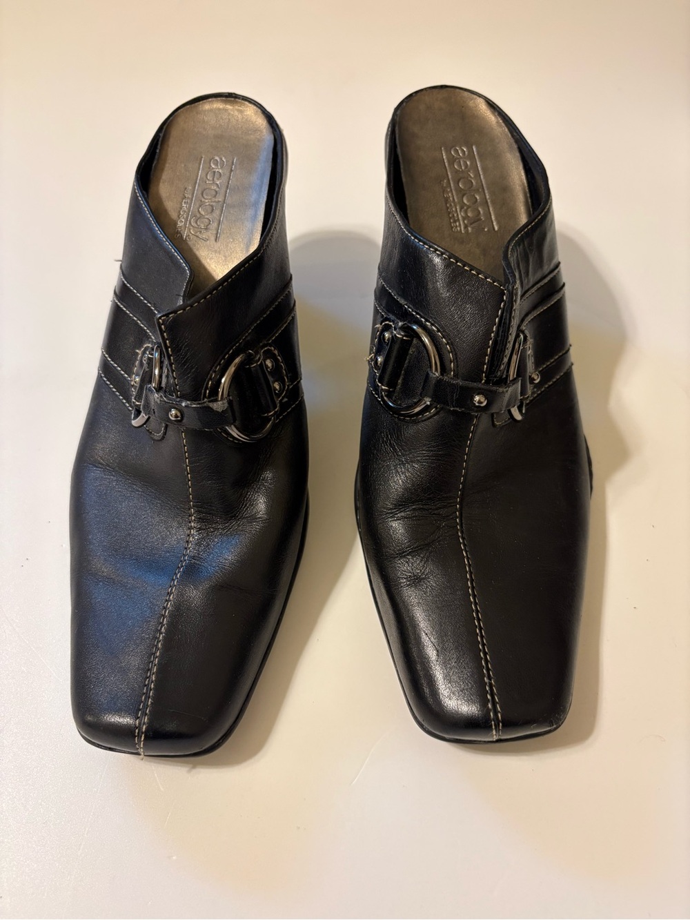 Aerology Black Leather Slip-On Mules with Buckle Accent